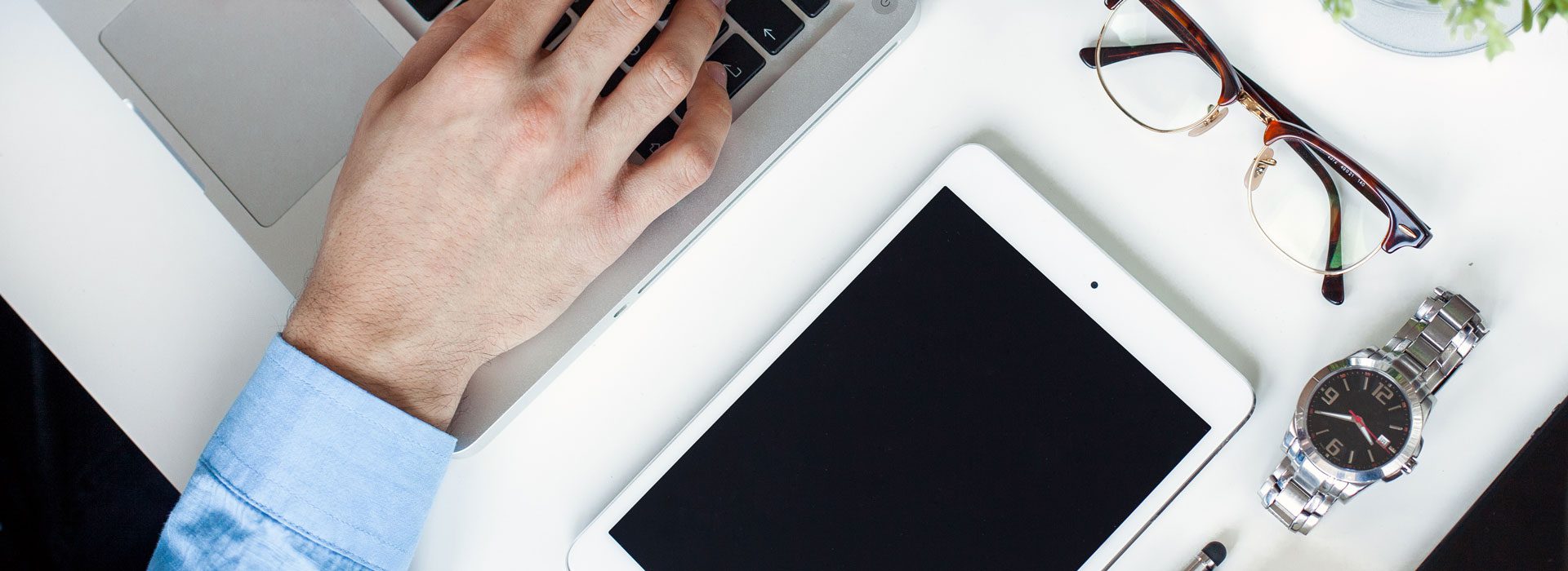 Header-Man-with-Laptop-and-Accessories