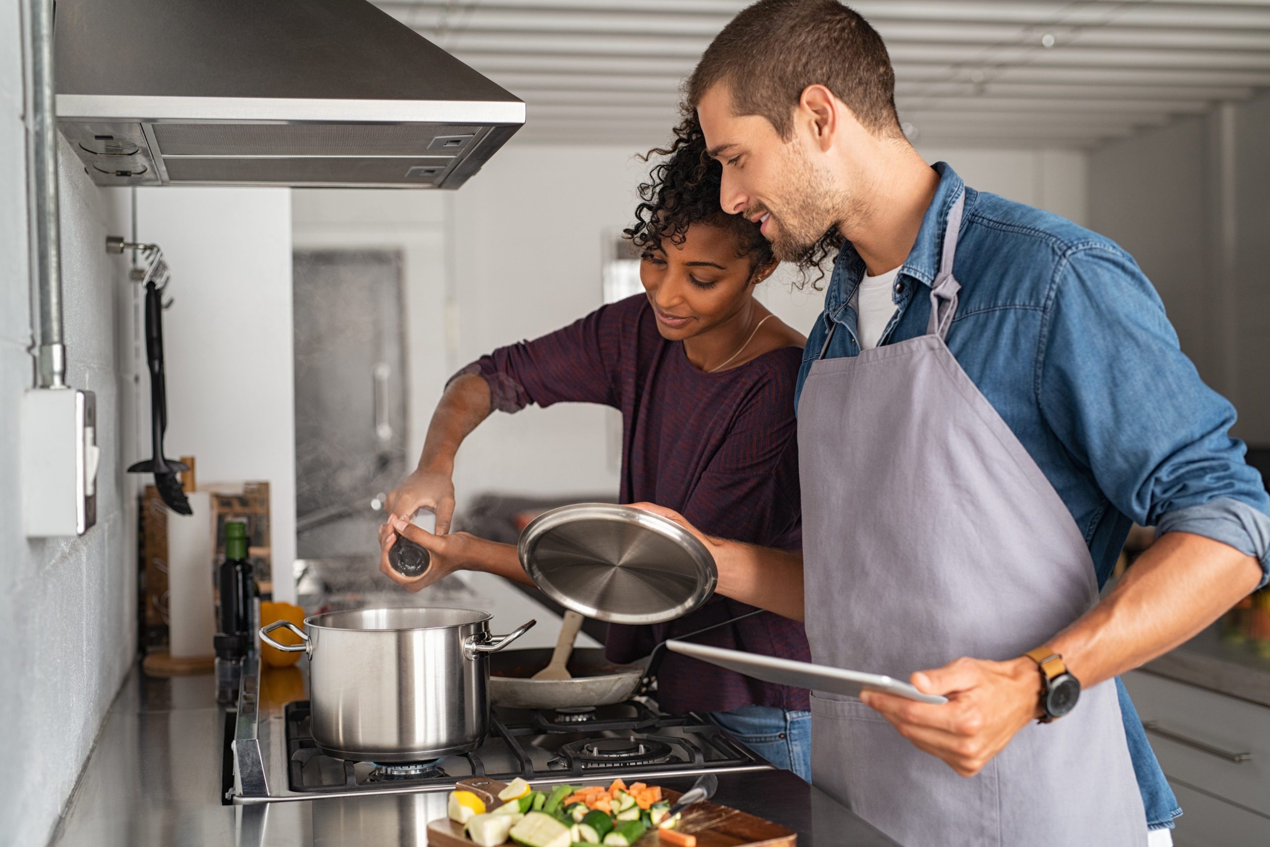 Blog - Woman adding salt in pot while cooking