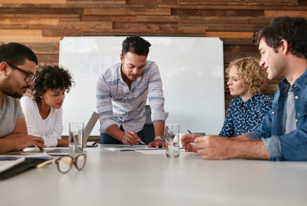 Blog - Creative team discussing new ideas on table