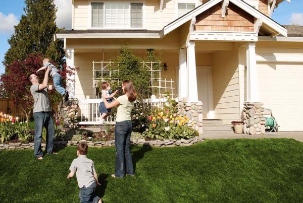 Blog - Family Playing Outside Their Two Story Home on a Beautiful Day