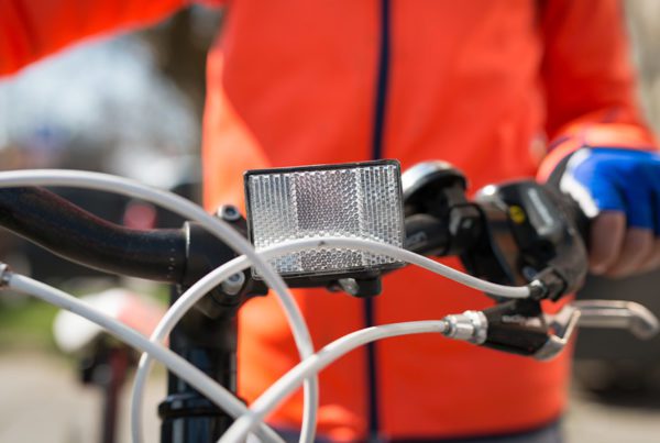 Blog - Closeup of a Front White Reflector on Bike